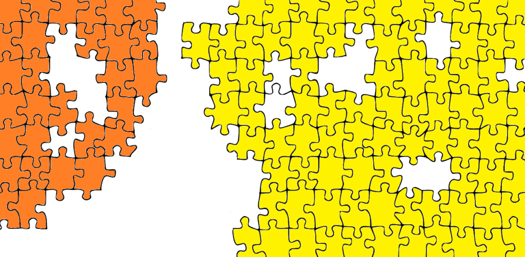 An unfinished puzzle with orange and yellow pieces